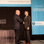 Dan Singleton, CEO of Transient Plasma Systems, accepts the WWL Orcelle® Award from Ray Fitzgerald of WWL.