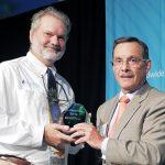 Tony Frudakis of Okeanos Technologies accepts the 2014 Gulfstream Navigator Award from Joe Lombardo.